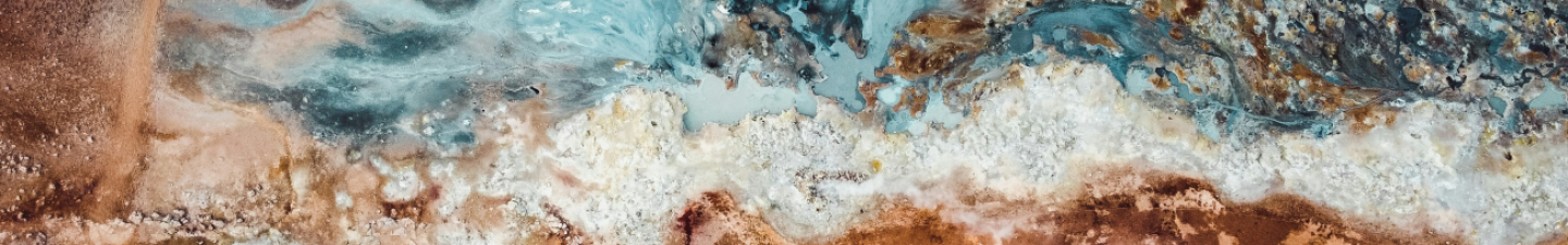 An image of Colorado minerals, showing a variety of colors and textures adjacent to each other in native stone.