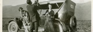 Mister Pimp Powers being held up by a man while Laura Evans, second from left, watches. 