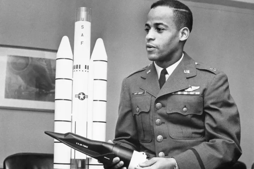Ed Dwight with model of a rocket, in his US Air Force uniform.