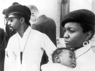 Mr. and Mrs. Sullivan, both members of the Black Panther Party, in uniform with their young child