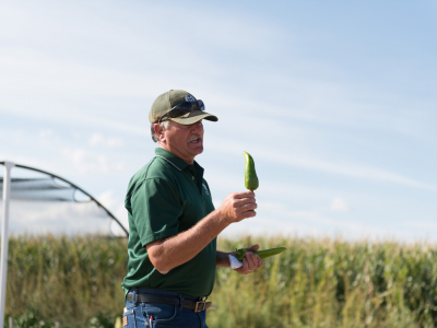 Mike Bartolo in a field holding a Mosco chile
